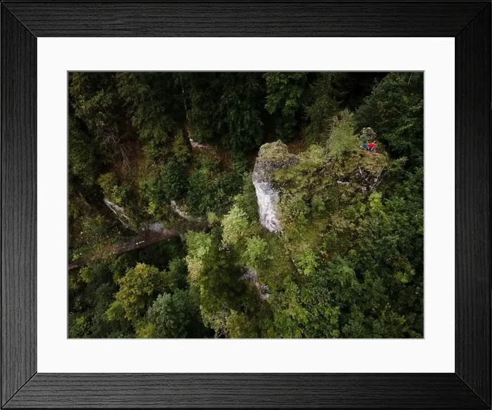 Framed Print : Hiker, middle-aged climber is on rock Framed Print : Hiker, middle-aged climber is on rock