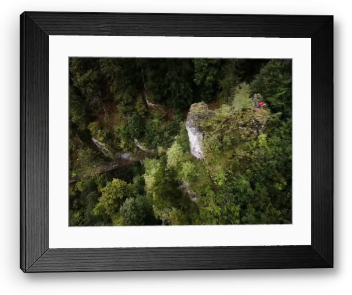 Framed Print : Hiker, middle-aged climber is on rock Framed Print : Hiker, middle-aged climber is on rock