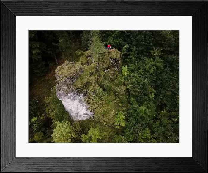 Framed Print : Hiker, middle-aged climber is on rock Framed Print : Hiker, middle-aged climber is on rock