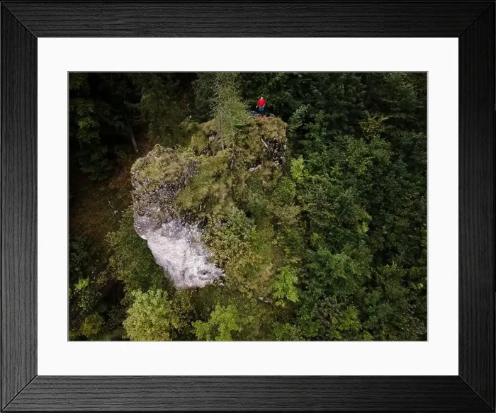 Framed Print : Hiker, middle-aged climber is on rock Framed Print : Hiker, middle-aged climber is on rock