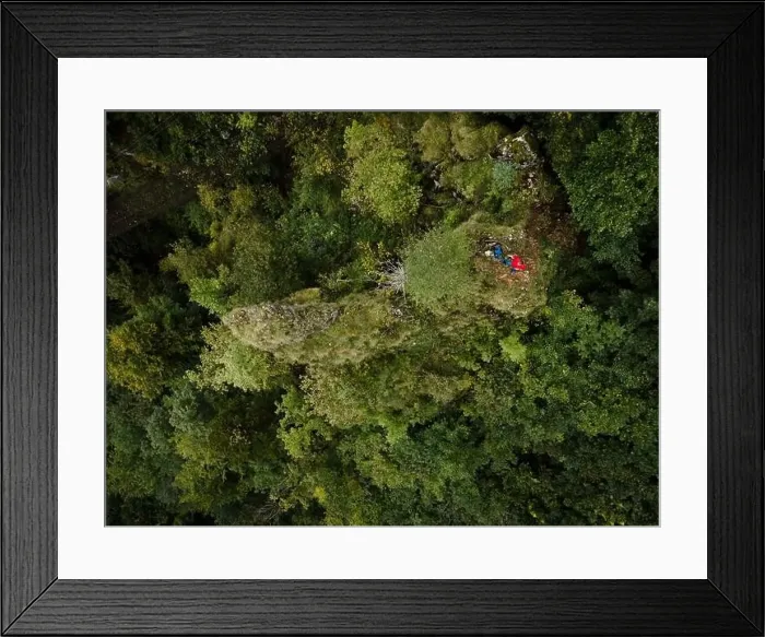 Framed Print : Hiker, middle-aged climber is on rock Framed Print : Hiker, middle-aged climber is on rock