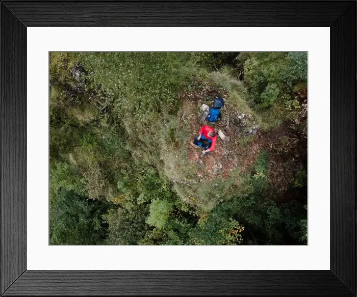 Framed Print : Hiker, middle-aged climber is on rock Framed Print : Hiker, middle-aged climber is on rock