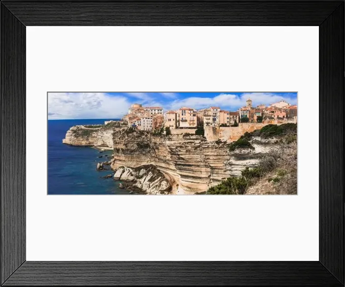 Framed Print : Bonifacio - splendid coastal town in south of Corsica island, aerial drone view of houses hanging over rocks. France Framed Print : Bonifacio - splendid coastal town in south of Corsica island, aerial drone view of houses hanging over rocks. France