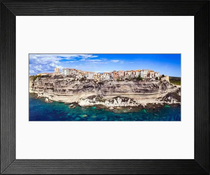 Framed Print : Bonifacio - splendid coastal town in south of Corsica island, aerial drone view of houses hanging over rocks. France Framed Print : Bonifacio - splendid coastal town in south of Corsica island, aerial drone view of houses hanging over rocks. France