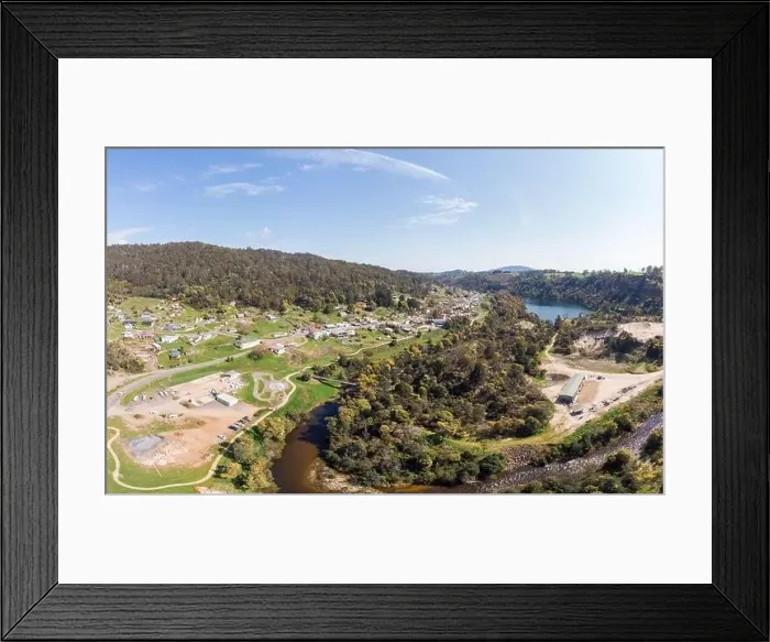 Framed Print : An aerial view from a drone on a warm spring day over Derby in Tasmania, Australia Framed Print : An aerial view from a drone on a warm spring day over Derby in Tasmania, Australia