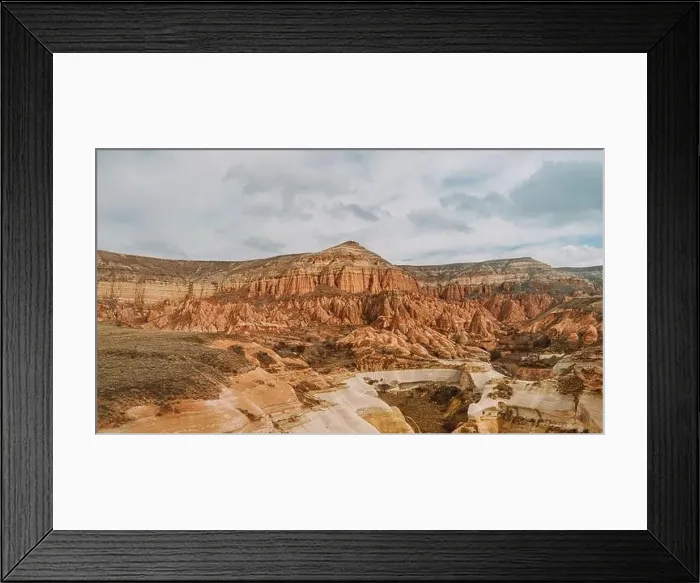 Framed Print : From above breathtaking scenery of massive rocky mountains located in Rose Valley against cloudy sky in Cappadocia Framed Print : From above breathtaking scenery of massive rocky mountains located in Rose Valley against cloudy sky in Cappadocia