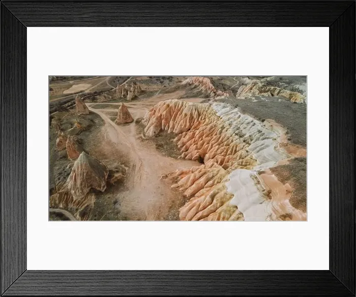 Framed Print : From above breathtaking scenery of massive rocky mountains located in Rose Valley against cloudy sky in Cappadocia Framed Print : From above breathtaking scenery of massive rocky mountains located in Rose Valley against cloudy sky in Cappadocia