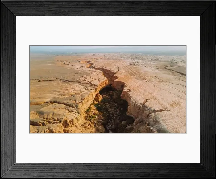 Framed Print : Breathtaking drone view of rough crack in dry soil of desert on sunny day in Iran Framed Print : Breathtaking drone view of rough crack in dry soil of desert on sunny day in Iran