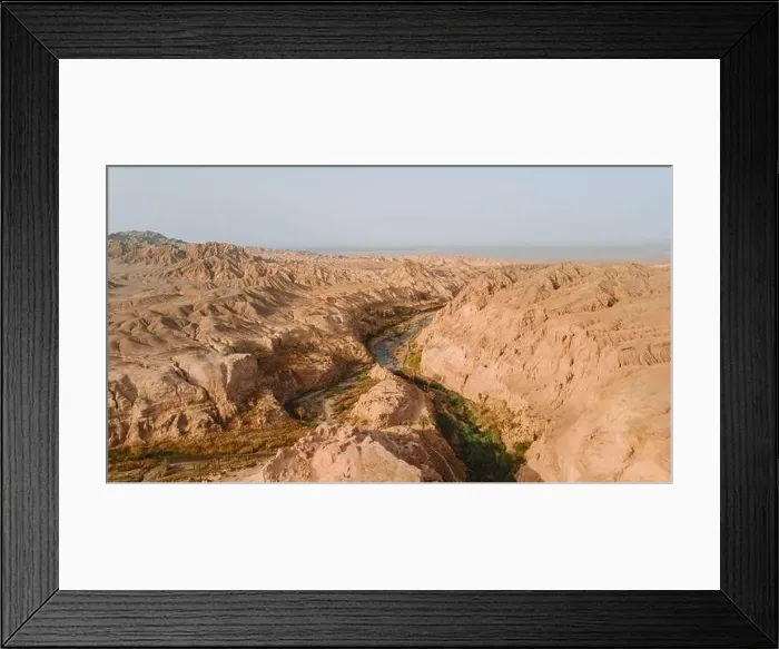Framed Print : Breathtaking drone view of rough crack in dry soil of desert on sunny day in Iran Framed Print : Breathtaking drone view of rough crack in dry soil of desert on sunny day in Iran