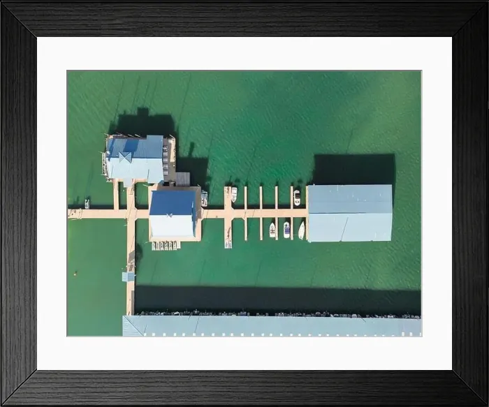 Framed Print : Aerial top down view of boat dock and yacht port, boats are moored on sea. Yacht club boats parking. Photo from drone