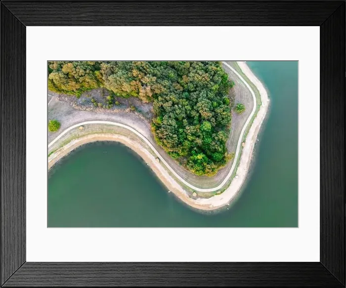 Framed Print : Aerial view of island with green trees and roads surrounded by sea or ocean with clear water Framed Print : Aerial view of island with green trees and roads surrounded by sea or ocean with clear water