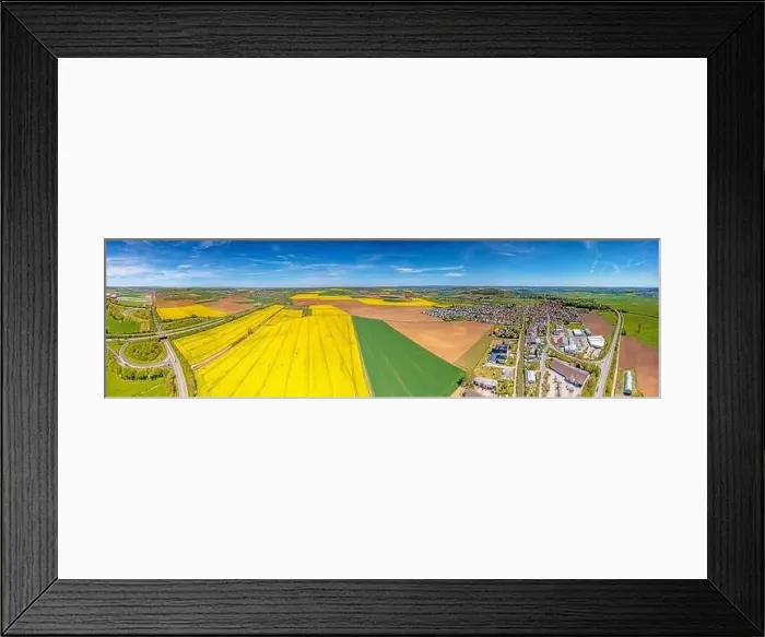 Framed Print : Aerial drone picture of rape field in spring in typical bright yellow color during daytime Framed Print : Aerial drone picture of rape field in spring in typical bright yellow color during daytime