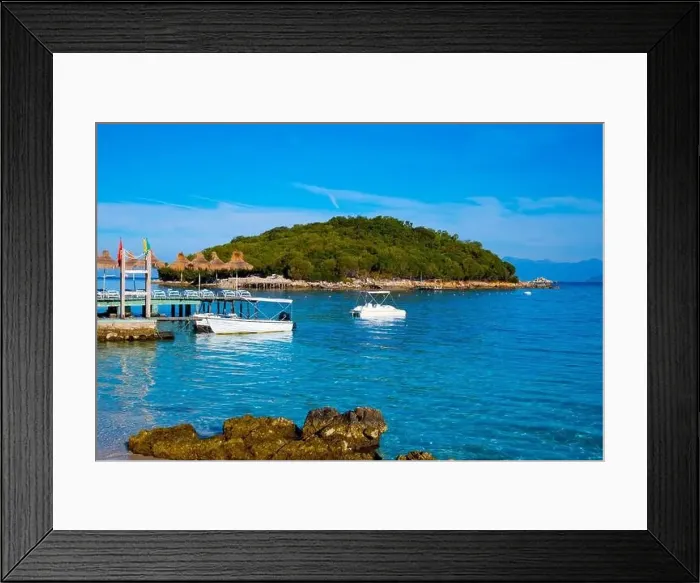 Framed Print : Bay in the city of Ksamil with ships and islands. Ionian Sea in Albania Framed Print : Bay in the city of Ksamil with ships and islands. Ionian Sea in Albania