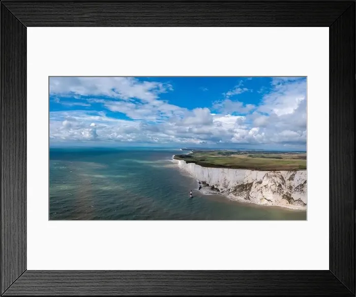 Framed Print : A panorama view of the Beachy Head Lighthouse in the English Channel and the white cliffs of the Jurassic Coast Framed Print : A panorama view of the Beachy Head Lighthouse in the English Channel and the white cliffs of the Jurassic Coast