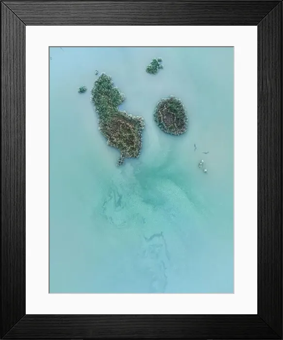 Framed Print : Drone view of overgrown with green tropical plants islands among turquoise ocean in Iceland Framed Print : Drone view of overgrown with green tropical plants islands among turquoise ocean in Iceland