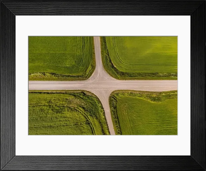 Framed Print : aerial view of a crossroads on country gravel no traffic road among fields Framed Print : aerial view of a crossroads on country gravel no traffic road among fields