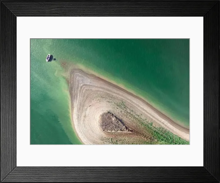 Framed Print : Aerial view of island with green plants and sand surrounded by sea or ocean Framed Print : Aerial view of island with green plants and sand surrounded by sea or ocean