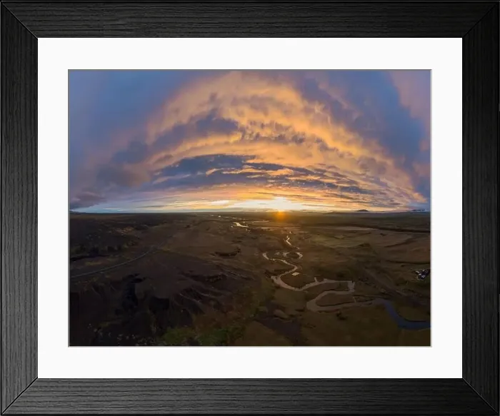 Framed Print : Scenic drone view of curvy river flowing in green valley against cloudy sundown sky in countryside of Iceland Framed Print : Scenic drone view of curvy river flowing in green valley against cloudy sundown sky in countryside of Iceland