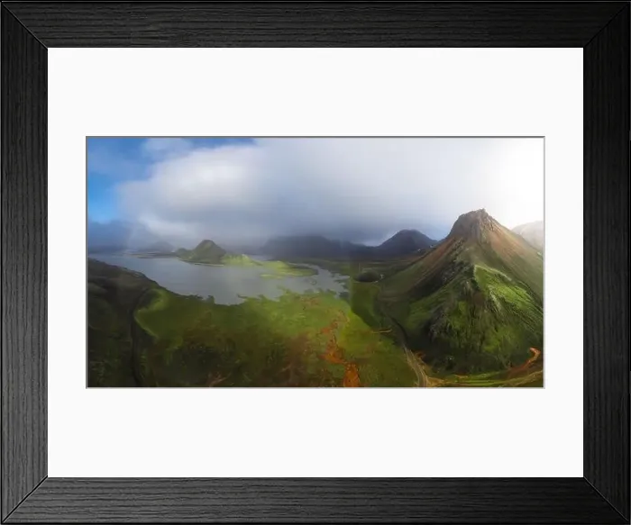 Framed Print : Breathtaking drone view of green mountains and calm lake located in volcanic terrain against cloudy blue sky in Iceland Framed Print : Breathtaking drone view of green mountains and calm lake located in volcanic terrain against cloudy blue sky in Iceland