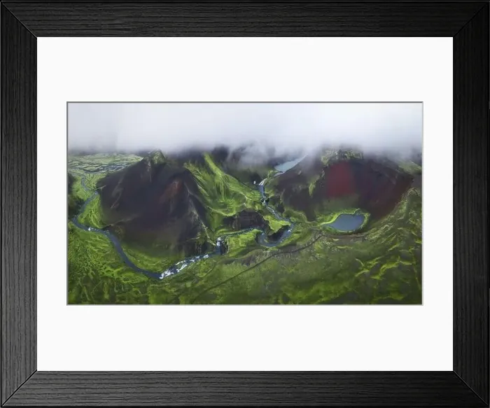 Framed Print : From above drone view of volcanic lakes and rivers located on green mountainous terrain on cloudy day in Iceland