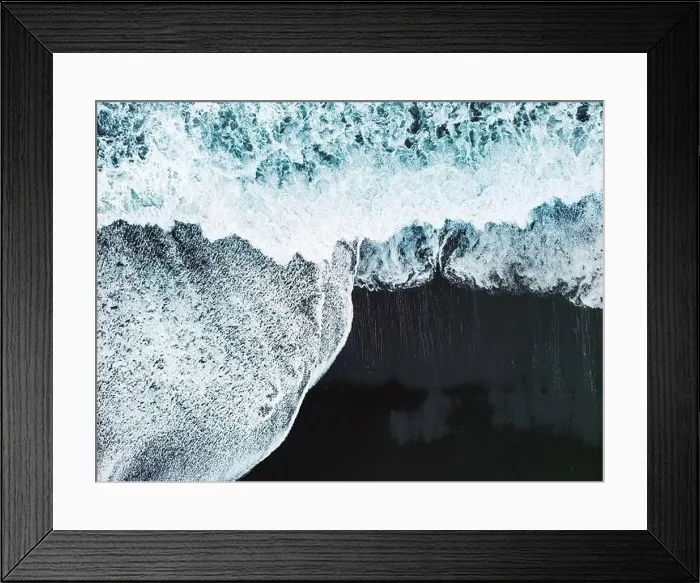 Framed Print : Drone shot waves crashing on the black sand beach Framed Print : Drone shot waves crashing on the black sand beach