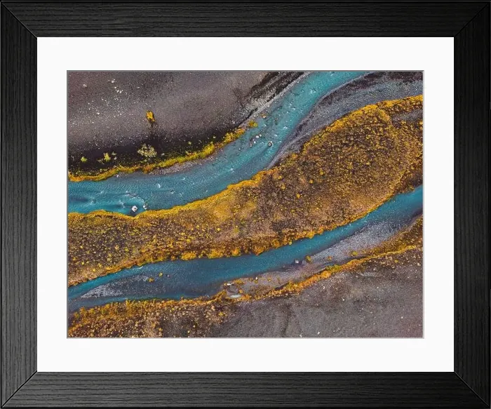 Framed Print : Drone shot river running trough black volcanic sand Framed Print : Drone shot river running trough black volcanic sand