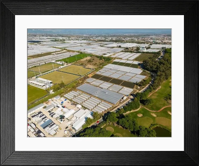Framed Print : Aerial views of rows of greenhouses taken by drone. Greenhouse roofs background texture Framed Print : Aerial views of rows of greenhouses taken by drone. Greenhouse roofs background texture