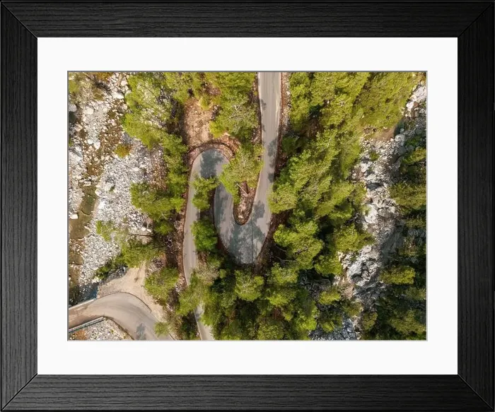 Framed Print : Top down view of road through forest at sunrise Framed Print : Top down view of road through forest at sunrise