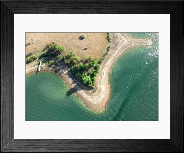 Framed Print : Aerial view of island with green trees and roads surrounded by sea or ocean with clear water Framed Print : Aerial view of island with green trees and roads surrounded by sea or ocean with clear water