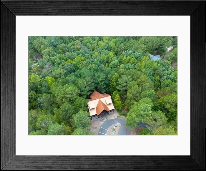 Framed Print : Aerial view of secluded cottage in the woods. Cabin in the forest in Broken Bow, Oklahoma USA Framed Print : Aerial view of secluded cottage in the woods. Cabin in the forest in Broken Bow, Oklahoma USA
