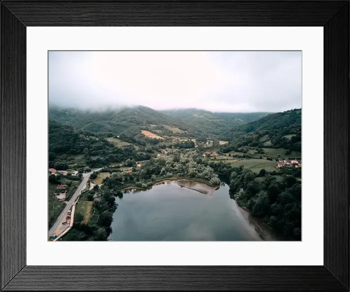 Framed Print : reservoir from a drone near the road that surrounds it and the forest vegetation on a cloudy day Framed Print : reservoir from a drone near the road that surrounds it and the forest vegetation on a cloudy day