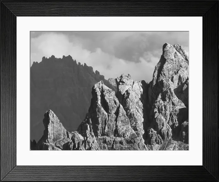 Framed Print : Breathtaking scenery of rough slope of massive rocky mountain range against clouds on sunny day in Dolomites Italy Framed Print : Breathtaking scenery of rough slope of massive rocky mountain range against clouds on sunny day in Dolomites Italy