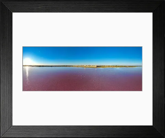 Framed Print : Aerial view of the beautiful pink lake and salt production of the Camargue in front of the village of Aigues Mortes Framed Print : Aerial view of the beautiful pink lake and salt production of the Camargue in front of the village of Aigues Mortes