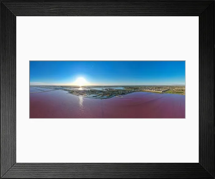Framed Print : Aerial view of the beautiful pink lake and salt production of the Camargue in front of the village of Aigues Mortes Framed Print : Aerial view of the beautiful pink lake and salt production of the Camargue in front of the village of Aigues Mortes