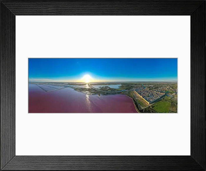 Framed Print : Aerial view of the beautiful pink lake and salt production of the Camargue in front of the village of Aigues Mortes Framed Print : Aerial view of the beautiful pink lake and salt production of the Camargue in front of the village of Aigues Mortes