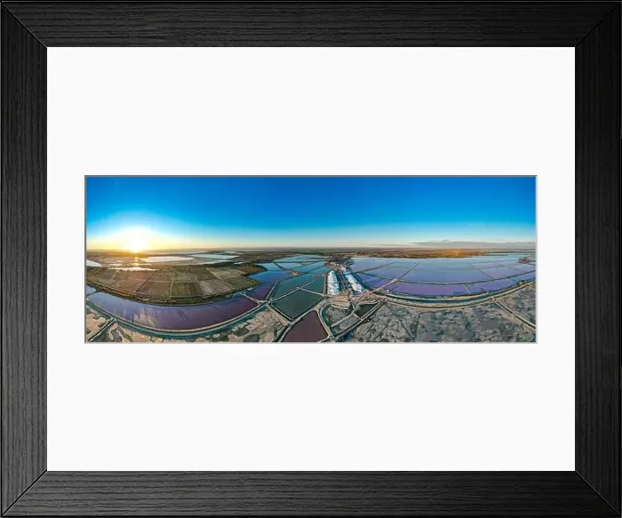 Framed Print : Aerial view of the beautiful pink lake and salt production of the Camargue in front of the village of Aigues Mortes Framed Print : Aerial view of the beautiful pink lake and salt production of the Camargue in front of the village of Aigues Mortes