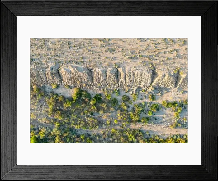 Framed Print : Aerial top view of sand quarry with green trees, slope of open pit Framed Print : Aerial top view of sand quarry with green trees, slope of open pit