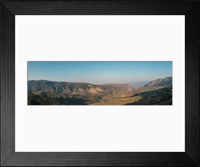 Framed Print : Mountain landscape wide panorama aerial drone view. Greece, Boeotia, Parnassos mountain, olive trees grove and blue sky Framed Print : Mountain landscape wide panorama aerial drone view. Greece, Boeotia, Parnassos mountain, olive trees grove and blue sky