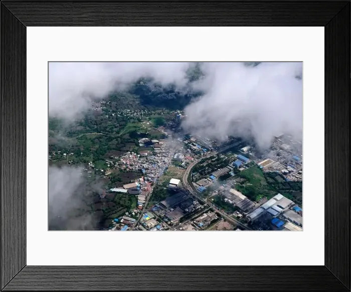 Framed Print : An aerial view of Mumbai's skyline passing over a building with roads and bridges Framed Print : An aerial view of Mumbai's skyline passing over a building with roads and bridges