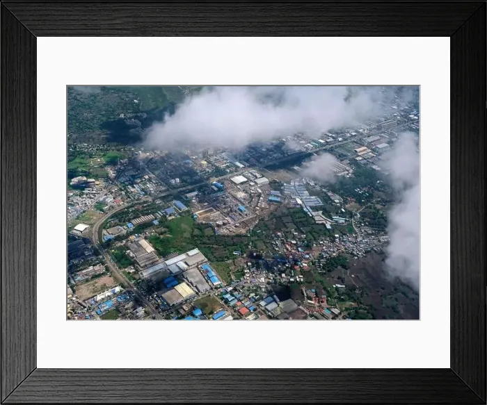 Framed Print : An aerial view of Mumbai's skyline passing over a building with roads and bridges Framed Print : An aerial view of Mumbai's skyline passing over a building with roads and bridges