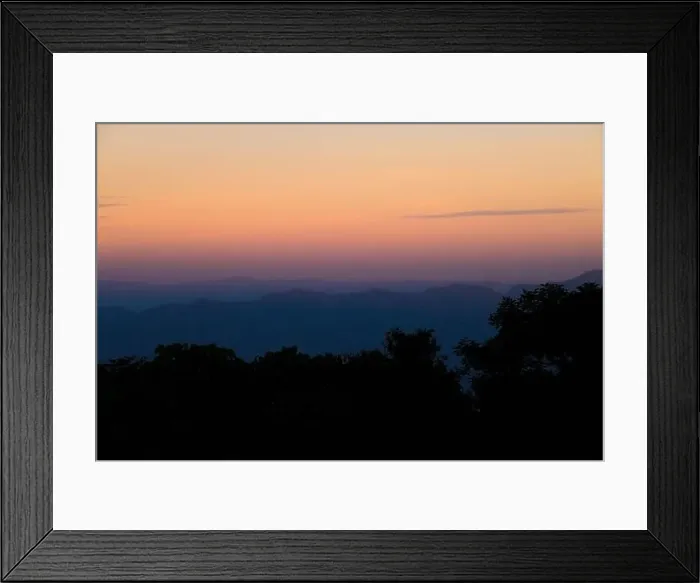 Framed Print : Aerial view of misty tropical forest with warm glow of sunrise in the morning Framed Print : Aerial view of misty tropical forest with warm glow of sunrise in the morning
