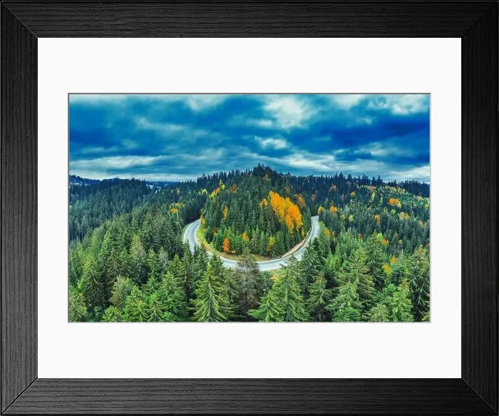 Framed Print : The road in the mountain forest. A wonderful autumn landscape. Drone view. Concept, freedom and travel Framed Print : The road in the mountain forest. A wonderful autumn landscape. Drone view. Concept, freedom and travel