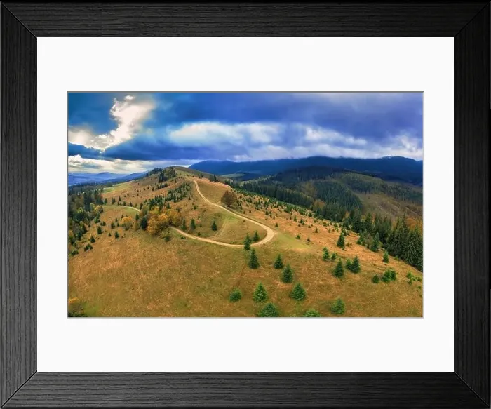 Framed Print : The road in the mountain forest. A wonderful autumn landscape. Drone view. Concept, freedom and travel Framed Print : The road in the mountain forest. A wonderful autumn landscape. Drone view. Concept, freedom and travel