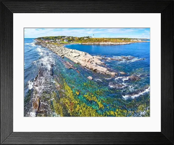 Framed Print : Rocky coastline with shallow waters and waves crashing in Maine and lighthouses in distance Framed Print : Rocky coastline with shallow waters and waves crashing in Maine and lighthouses in distance
