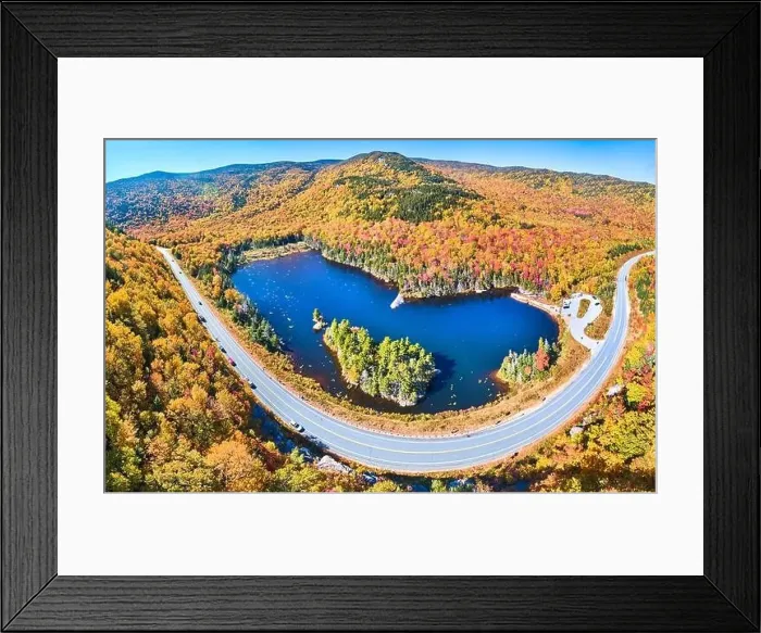 Framed Print : Wide panorama aerial over highway through stunning peak fall foliage New Hampshire mountains around blue lake Framed Print : Wide panorama aerial over highway through stunning peak fall foliage New Hampshire mountains around blue lake