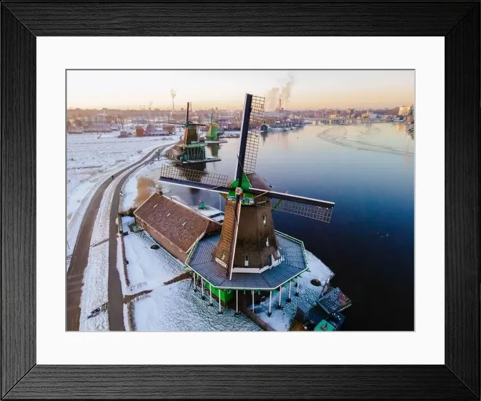 Framed Print : Drone view at the Zaanse Schans windmill village during winter with snow landscape in the Netherlands Holland village Framed Print : Drone view at the Zaanse Schans windmill village during winter with snow landscape in the Netherlands Holland village
