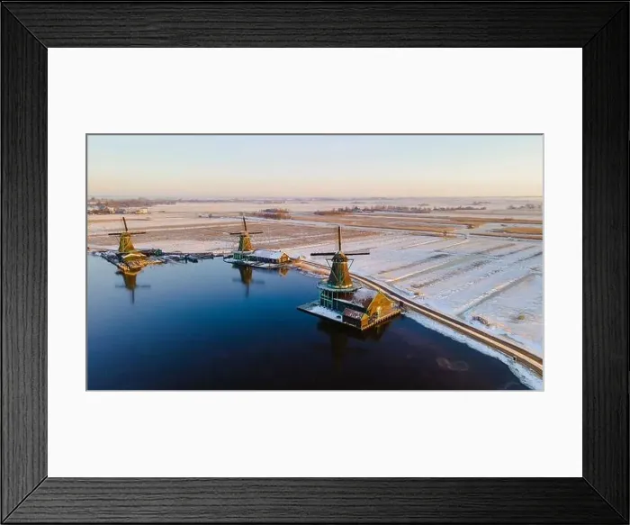 Framed Print : Drone view at the Zaanse Schans windmill village during winter with snow landscape in the Netherlands Holland village Framed Print : Drone view at the Zaanse Schans windmill village during winter with snow landscape in the Netherlands Holland village