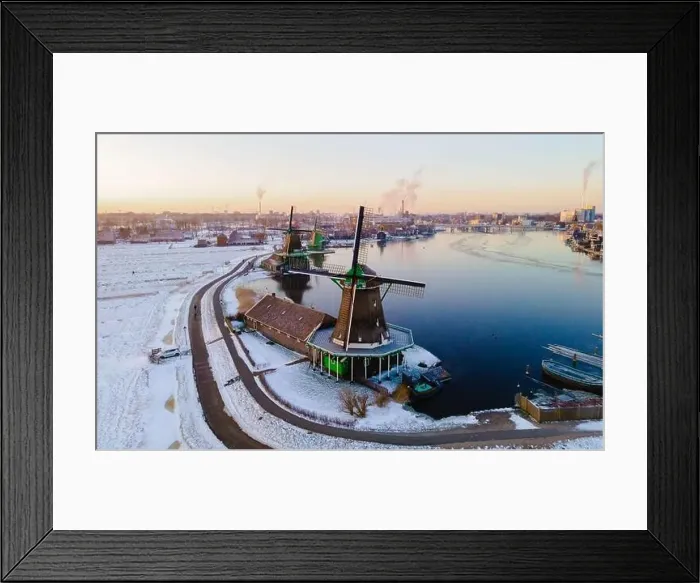 Framed Print : Zaanse Schans windmill village during winter with snow landscape in the Netherlands Holland village in winter Framed Print : Zaanse Schans windmill village during winter with snow landscape in the Netherlands Holland village in winter