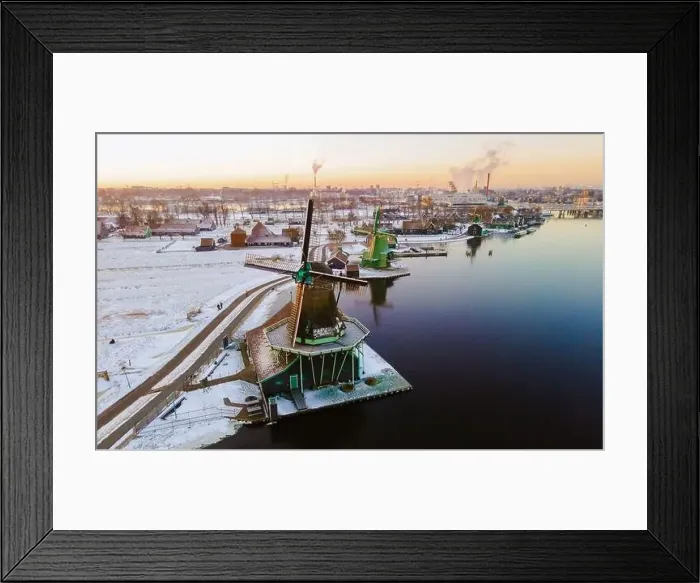 Framed Print : Zaanse Schans windmill village during winter with snow landscape in the Netherlands Holland village in winter Framed Print : Zaanse Schans windmill village during winter with snow landscape in the Netherlands Holland village in winter
