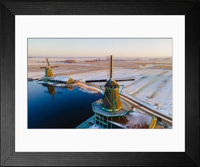 Framed Print : Zaanse Schans windmill village during winter with snow landscape in the Netherlands Holland village in winter Framed Print : Zaanse Schans windmill village during winter with snow landscape in the Netherlands Holland village in winter